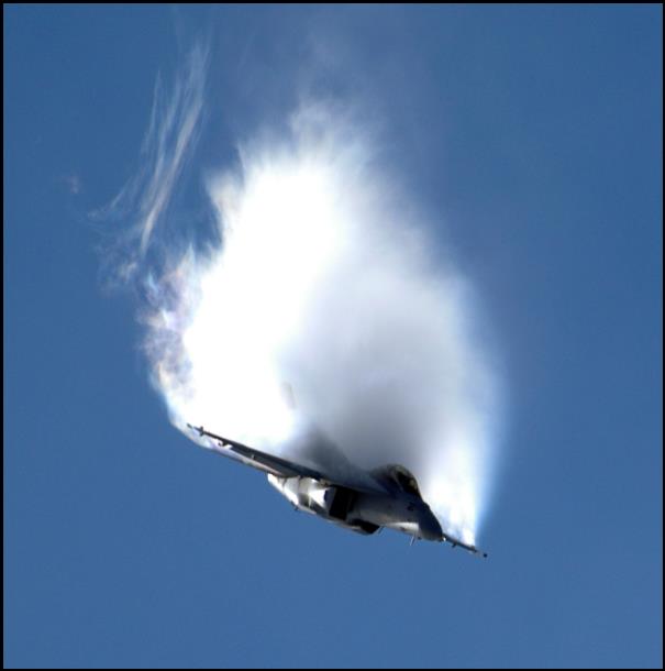 http://upload.wikimedia.org/wikipedia/commons/6/6c/FA-18F_vapor_over_wings_1.jpg