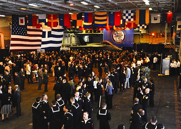 Sailors and guests mingle at a reception aboard the aircraft carrier USS Enterprise (CVN 65). Enterprise is in Piraeus, Greece, for a three-day port visit.